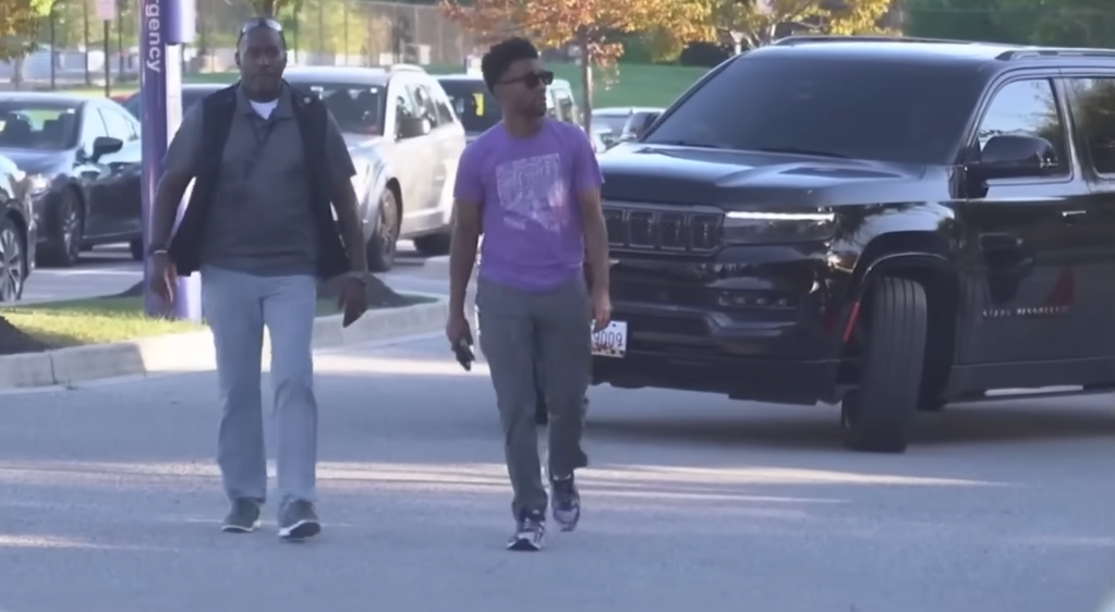 Baltimore Mayor Brandon Scott exits his Jeep Grand Wagoneer after being dropped off in the city.